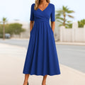 Short sleeve dress with crossed design and A-line fit.