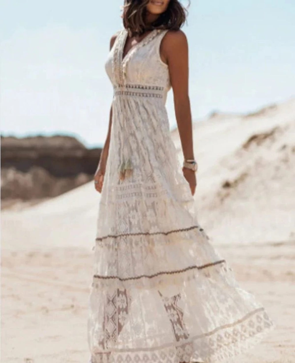 Flowy boho dress with drawstring waist and tassels.