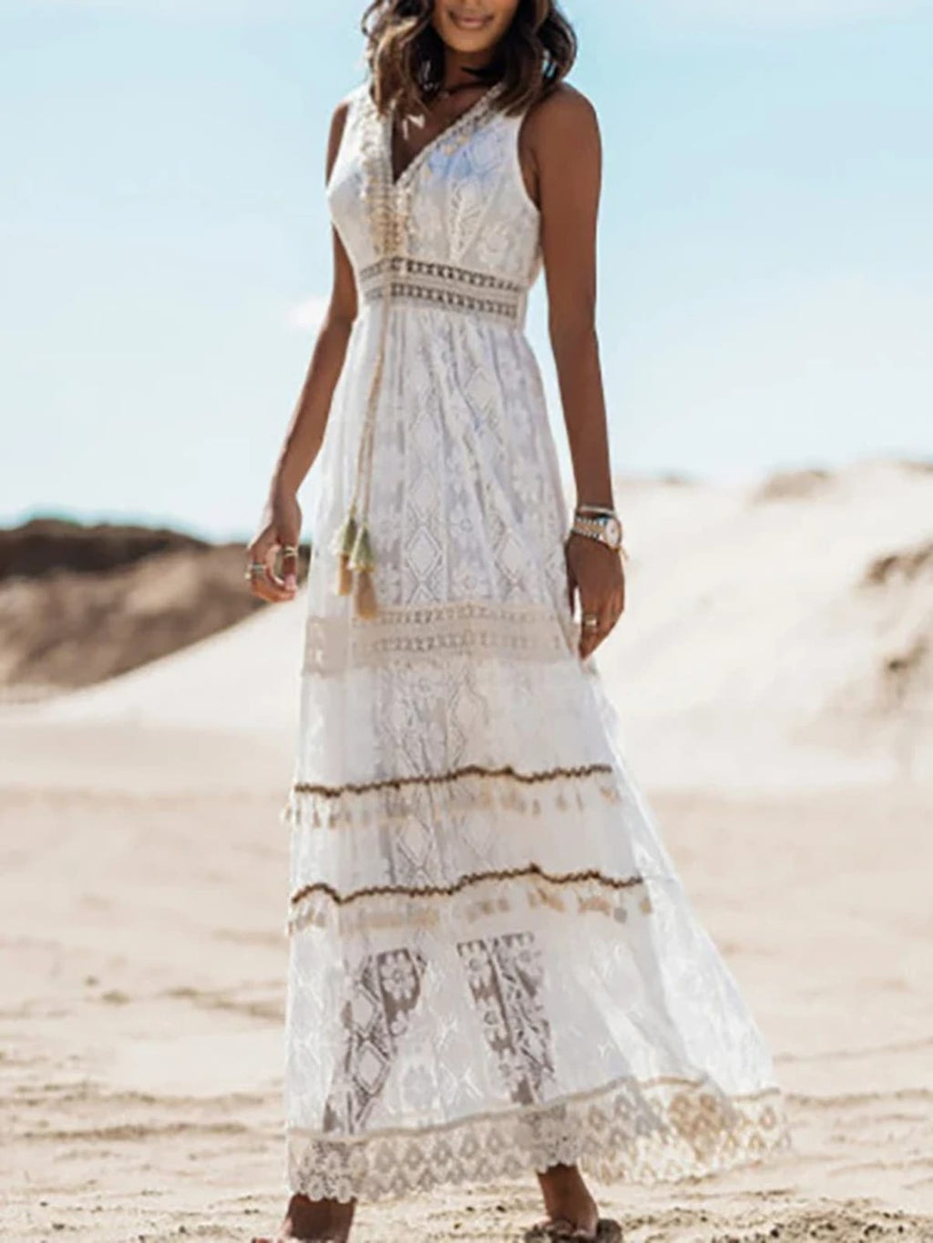Flowy boho dress with drawstring waist and tassels.