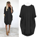 Elegant dress with side pockets and flowing drape.