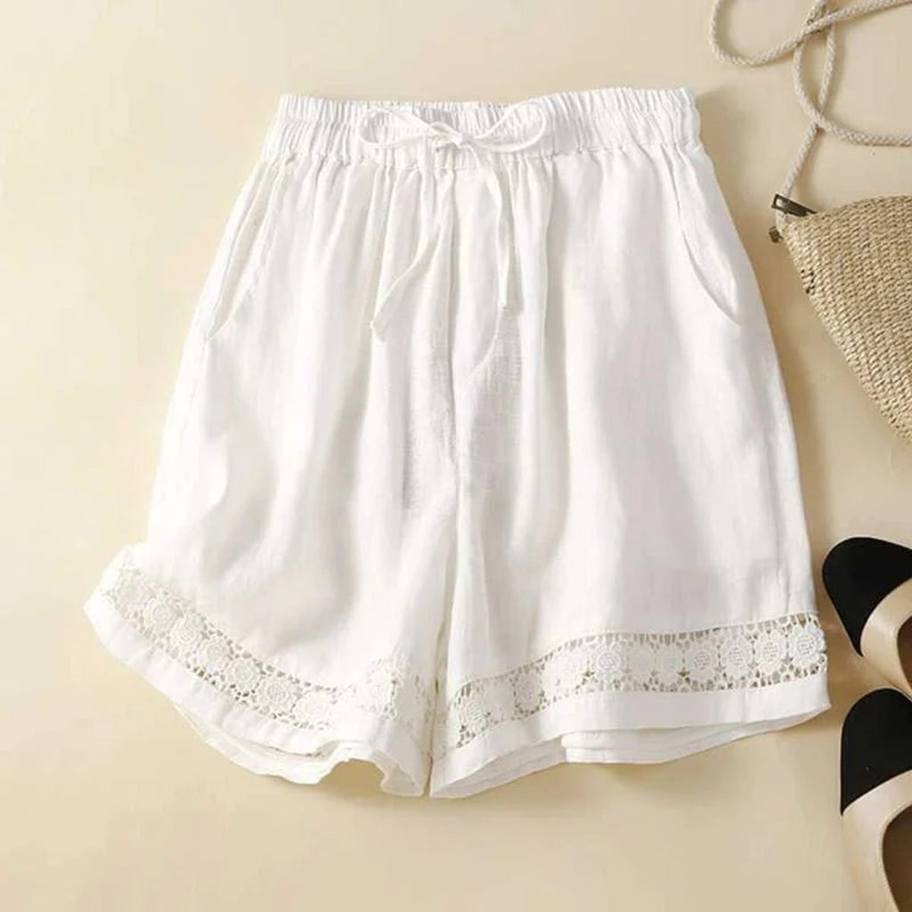 Relaxed floral shorts with embroidered hem and elastic waist.