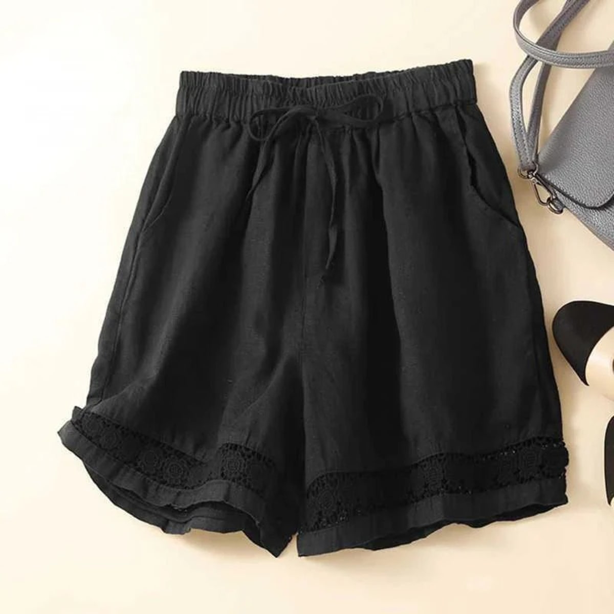 Relaxed floral shorts with embroidered hem and elastic waist.