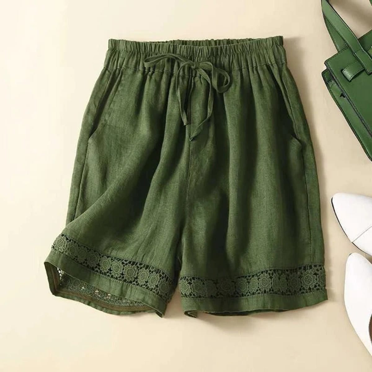 Relaxed floral shorts with embroidered hem and elastic waist.
