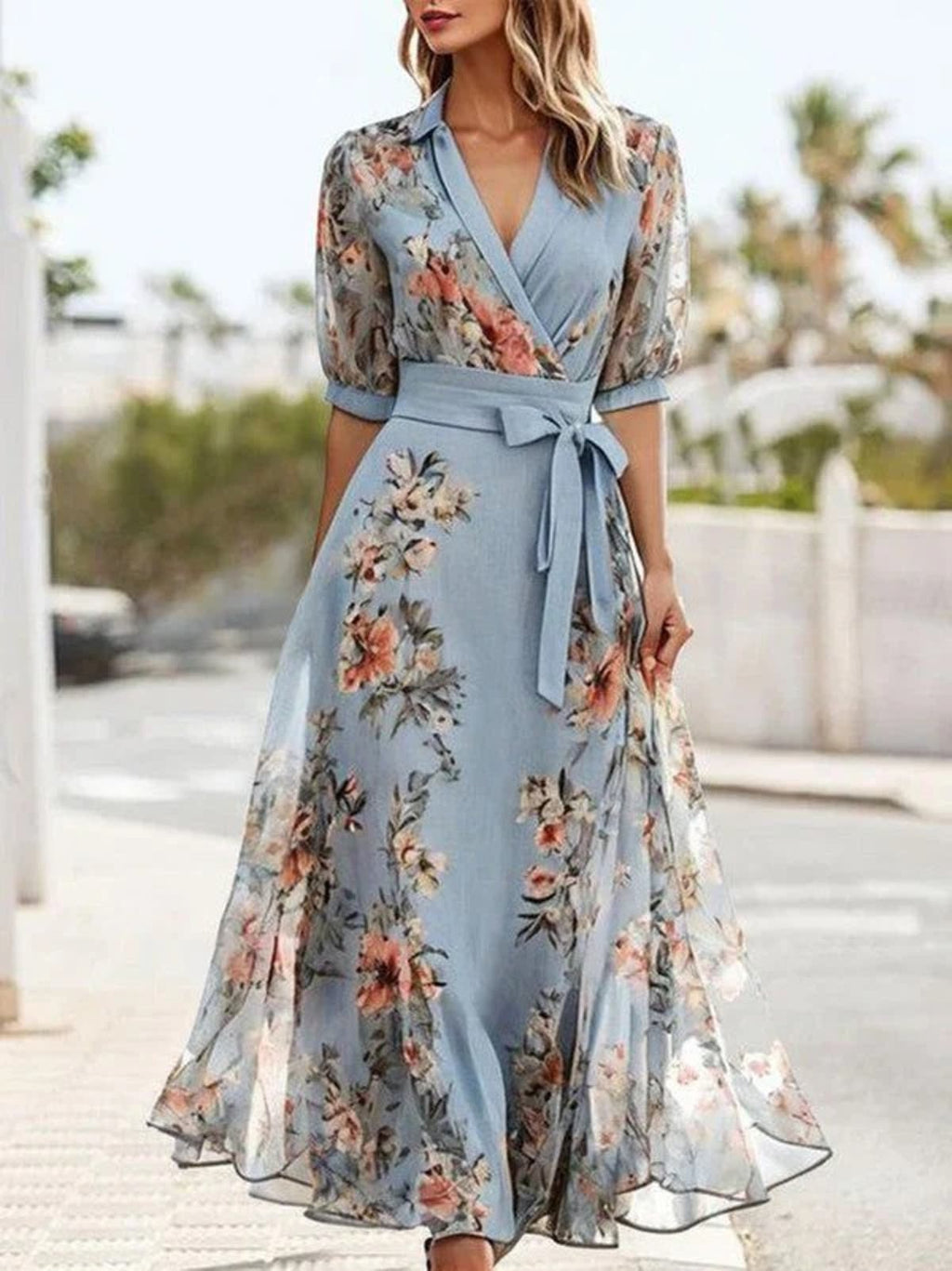 Flared midi dress with V-neckline and soft silhouette.