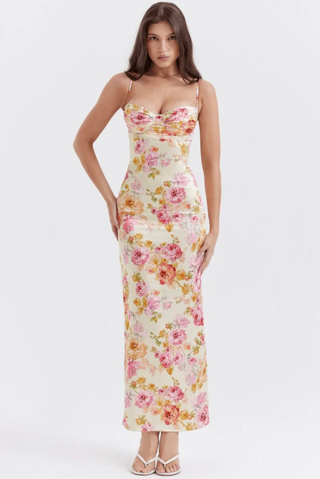 Floral spaghetti strap dress with flowing fit and lightweight fabric.