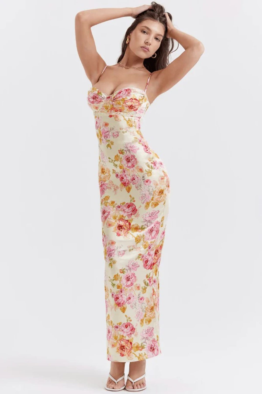 Floral spaghetti strap dress with flowing fit and lightweight fabric.