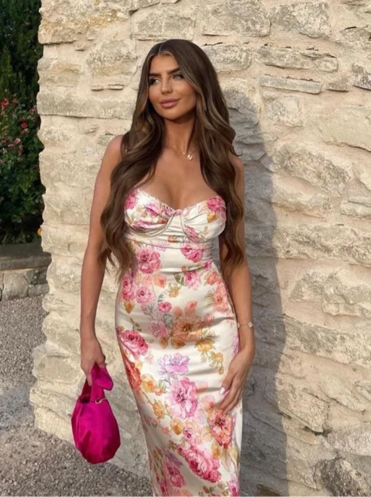 Floral spaghetti strap dress with flowing fit and lightweight fabric.
