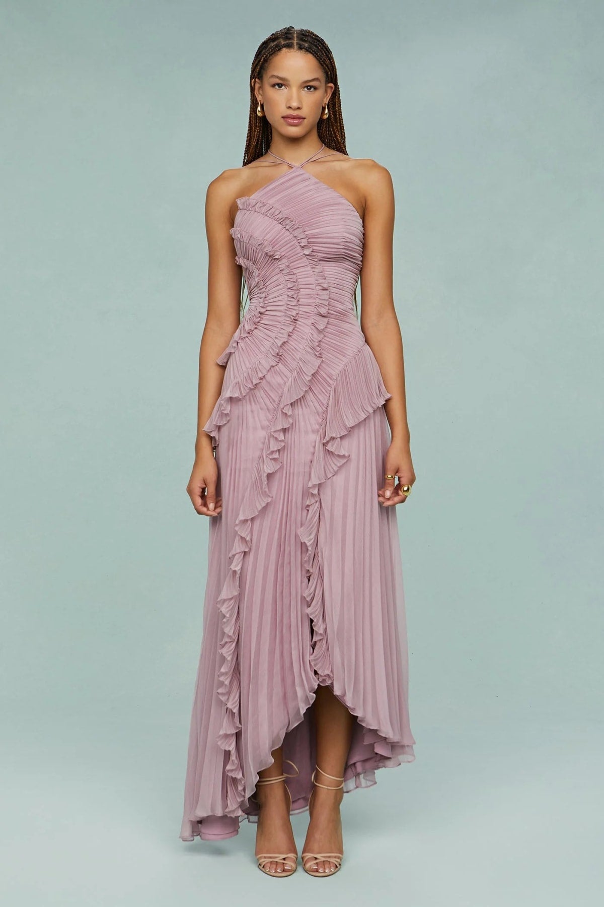 Halter dress with sculpted pleats and flowing skirt for special occasions.