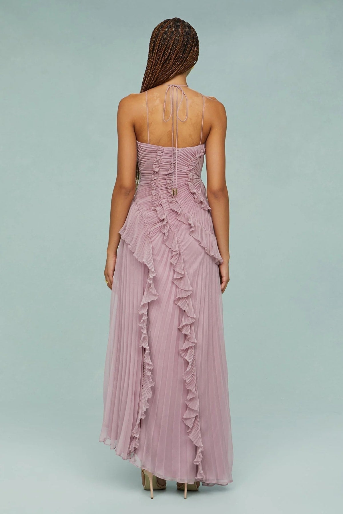 Halter dress with sculpted pleats and flowing skirt for special occasions.