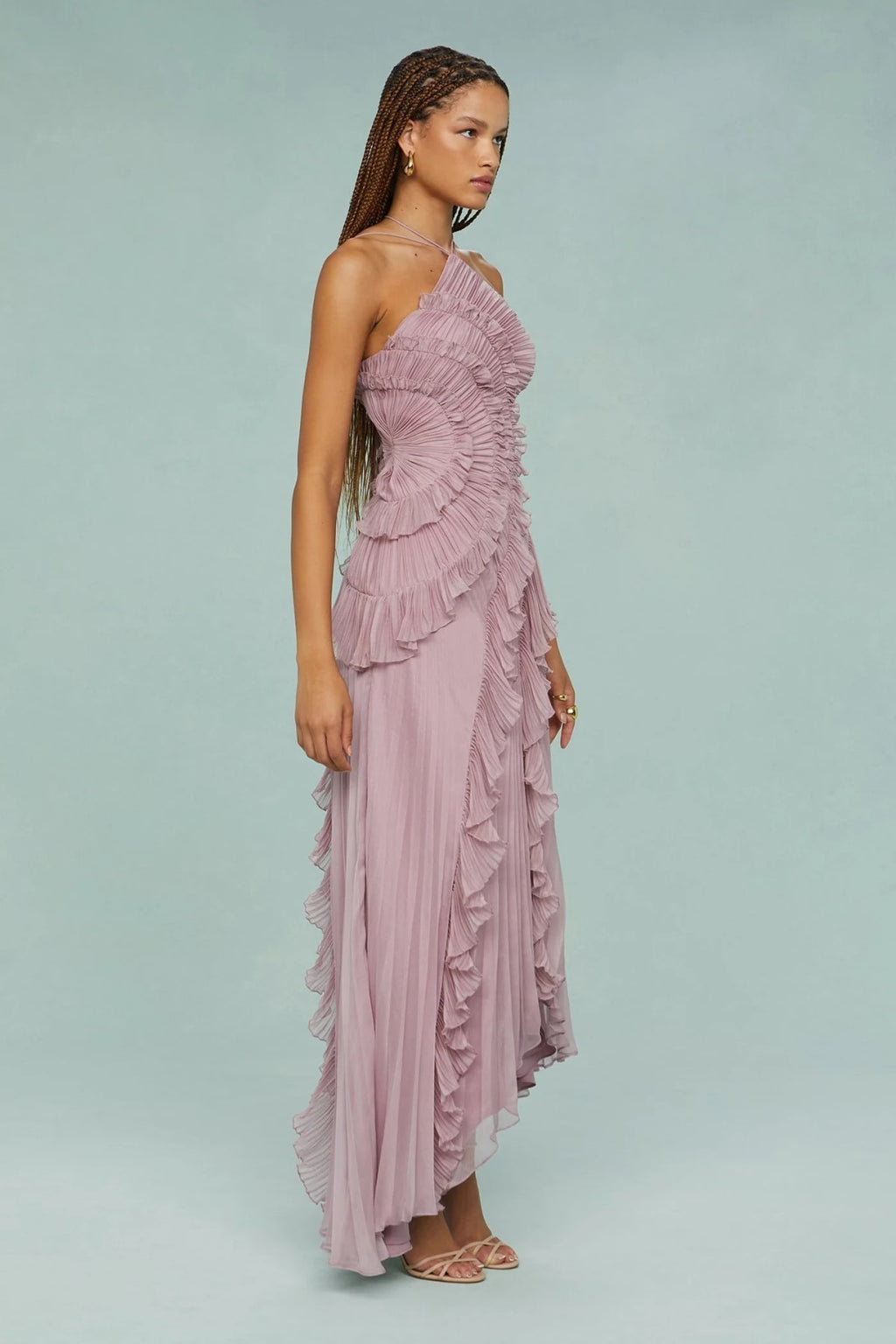 Halter dress with sculpted pleats and flowing skirt for special occasions.