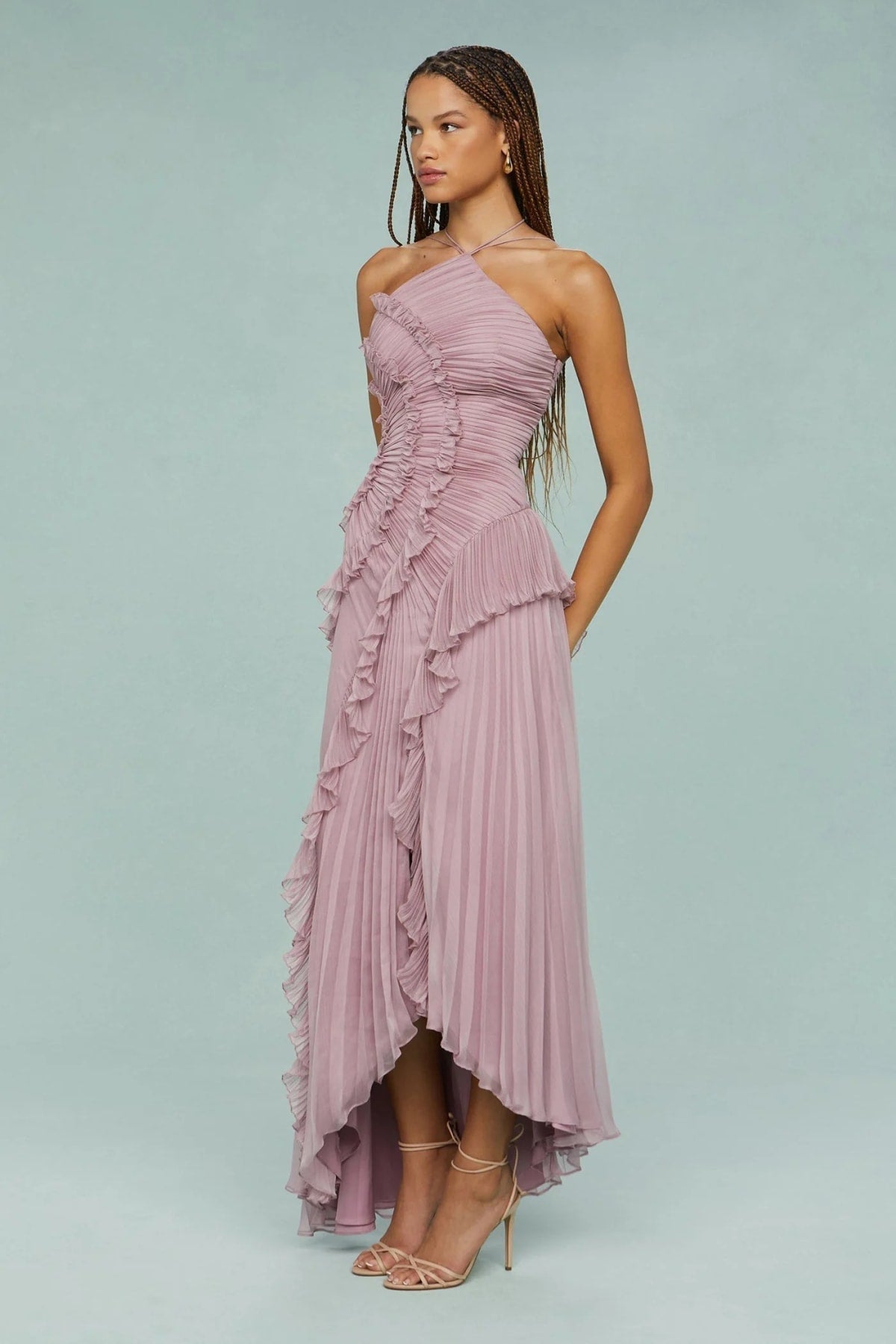 Halter dress with sculpted pleats and flowing skirt for special occasions.
