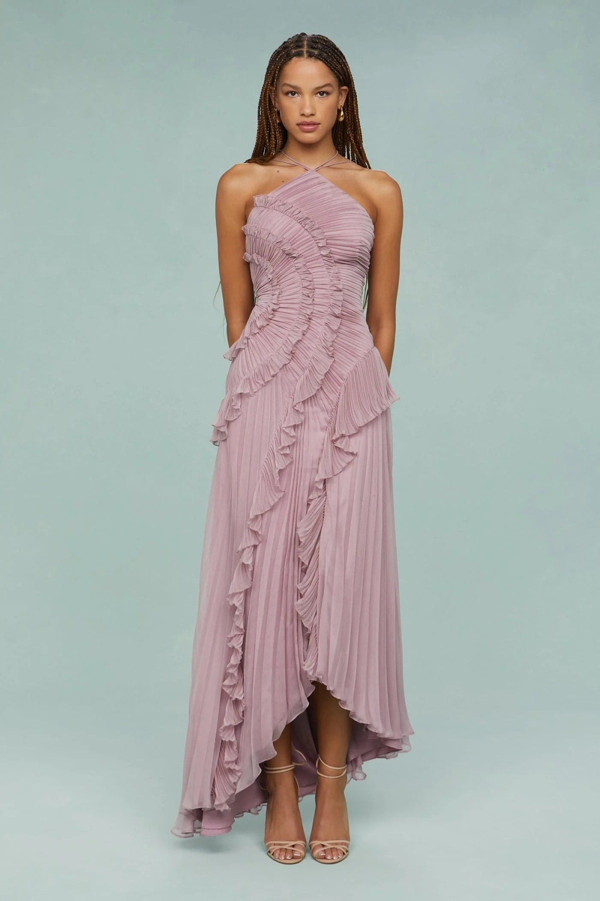 Halter dress with sculpted pleats and flowing skirt for special occasions.
