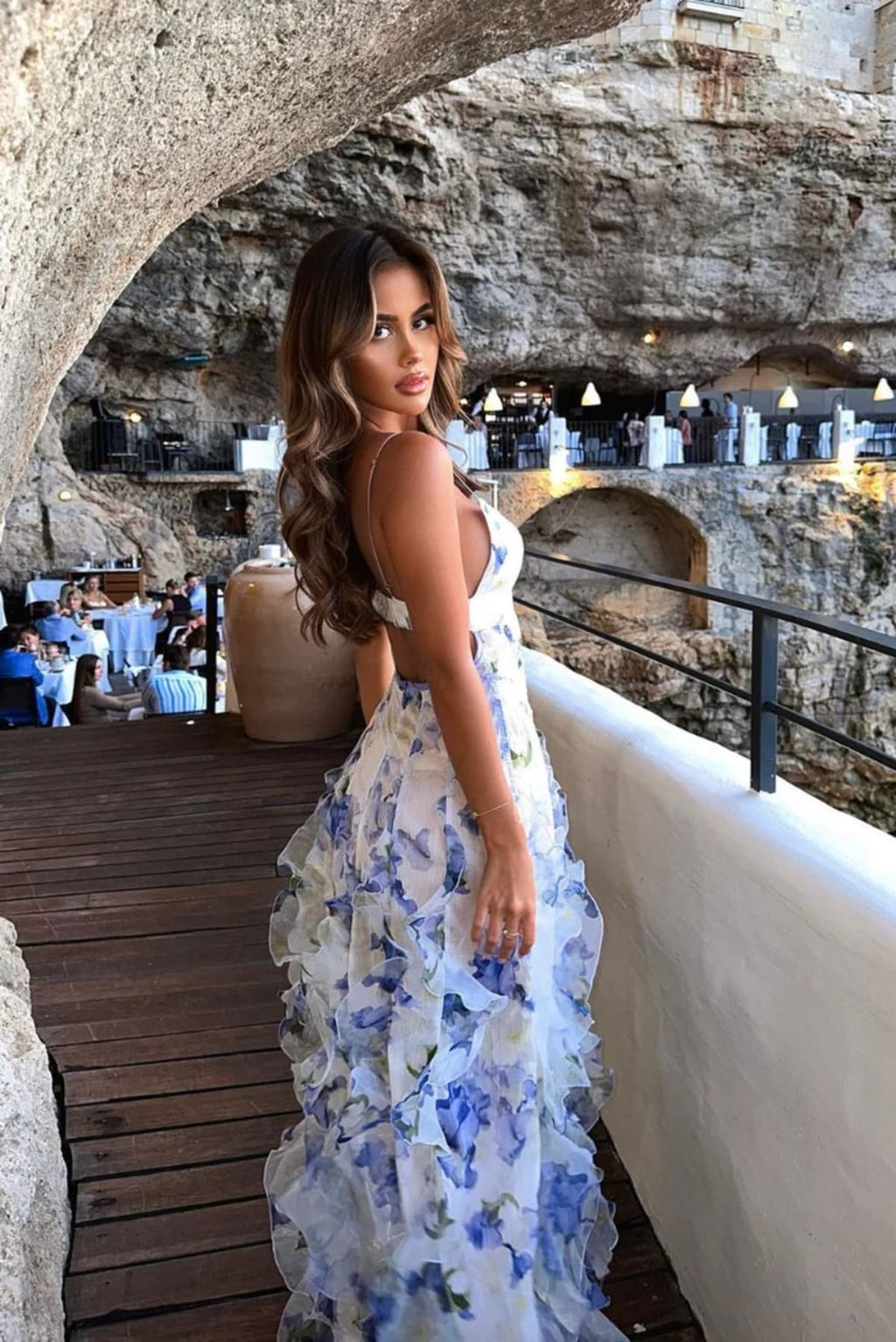 Lace floral maxi dress with cut-out details and split skirt.