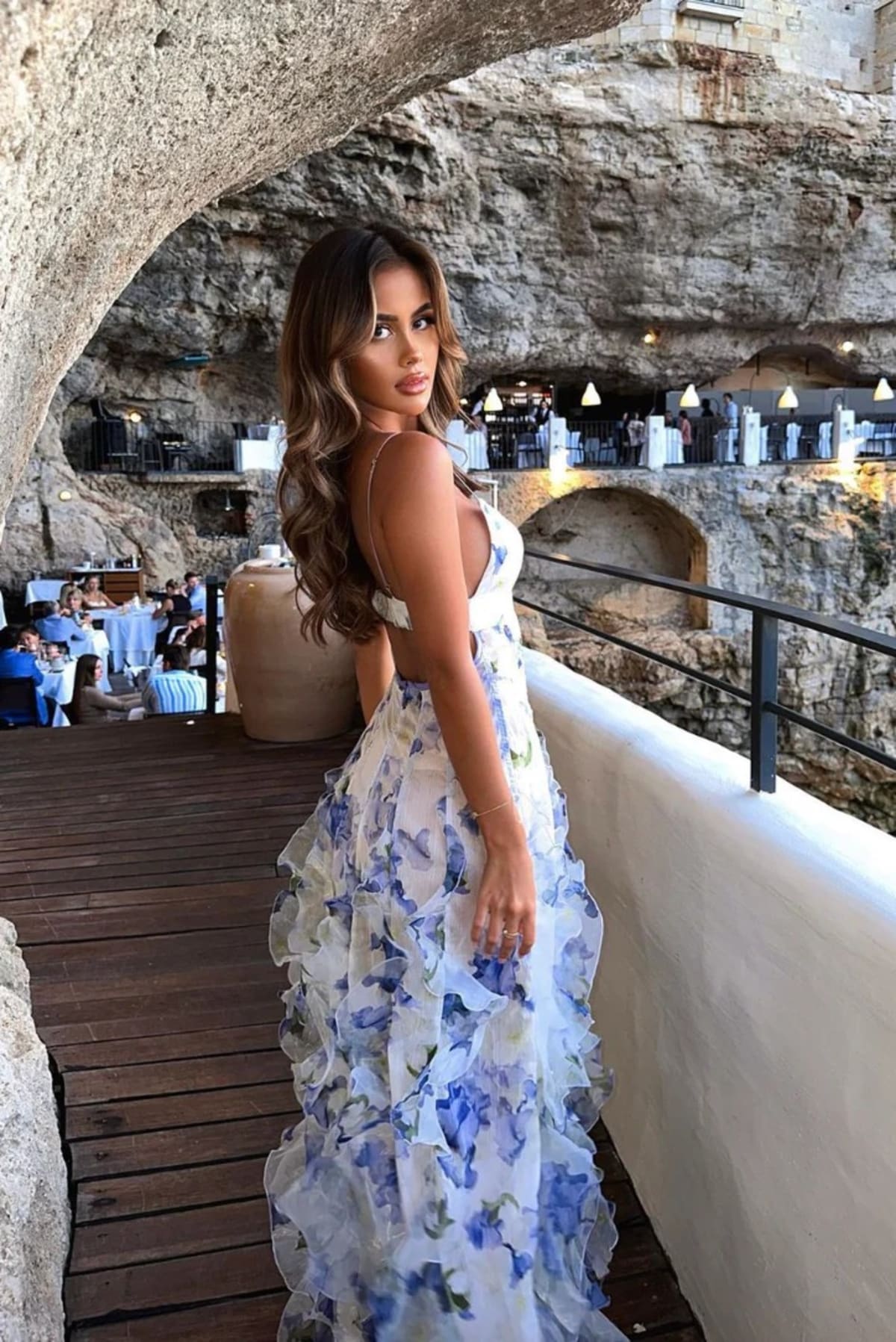 Lace floral maxi dress with cut-out details and split skirt.