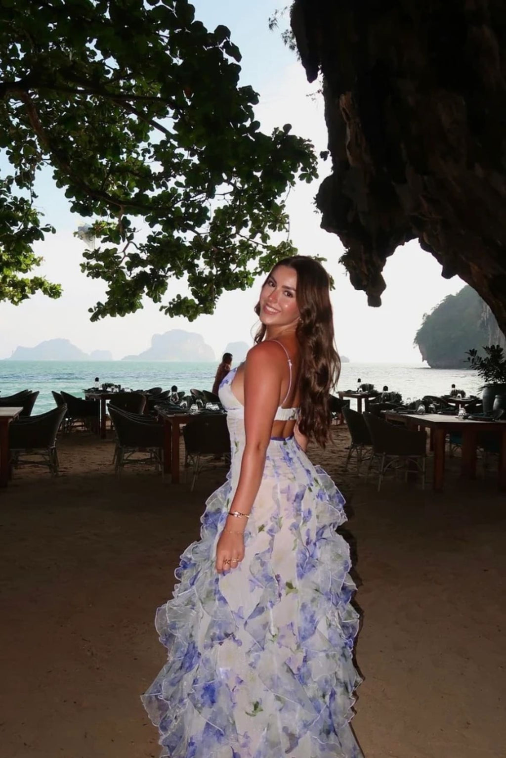 Lace floral maxi dress with cut-out details and split skirt.