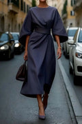 Elegant dress with lantern sleeves and adjustable waist bow.