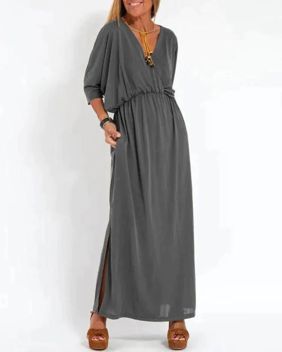 Long flowing dress with tailored fit and lightweight fabric.