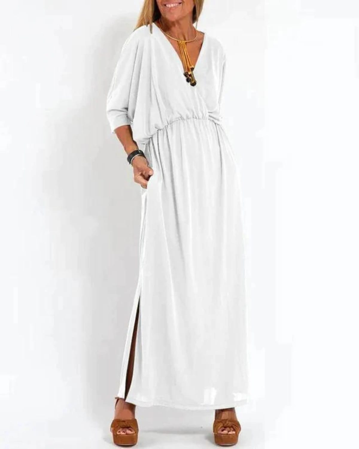 Long flowing dress with tailored fit and lightweight fabric.