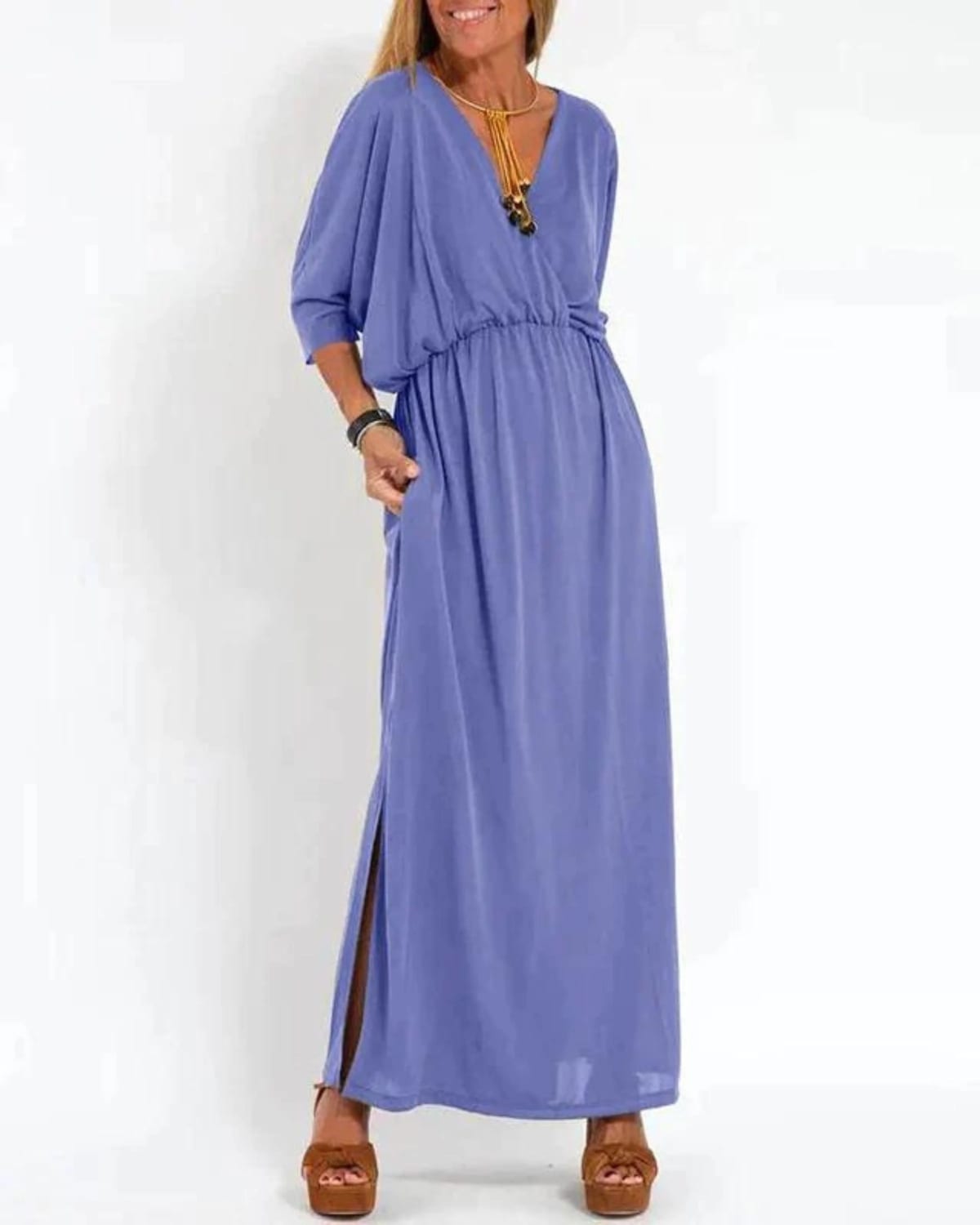 Long flowing dress with tailored fit and lightweight fabric.