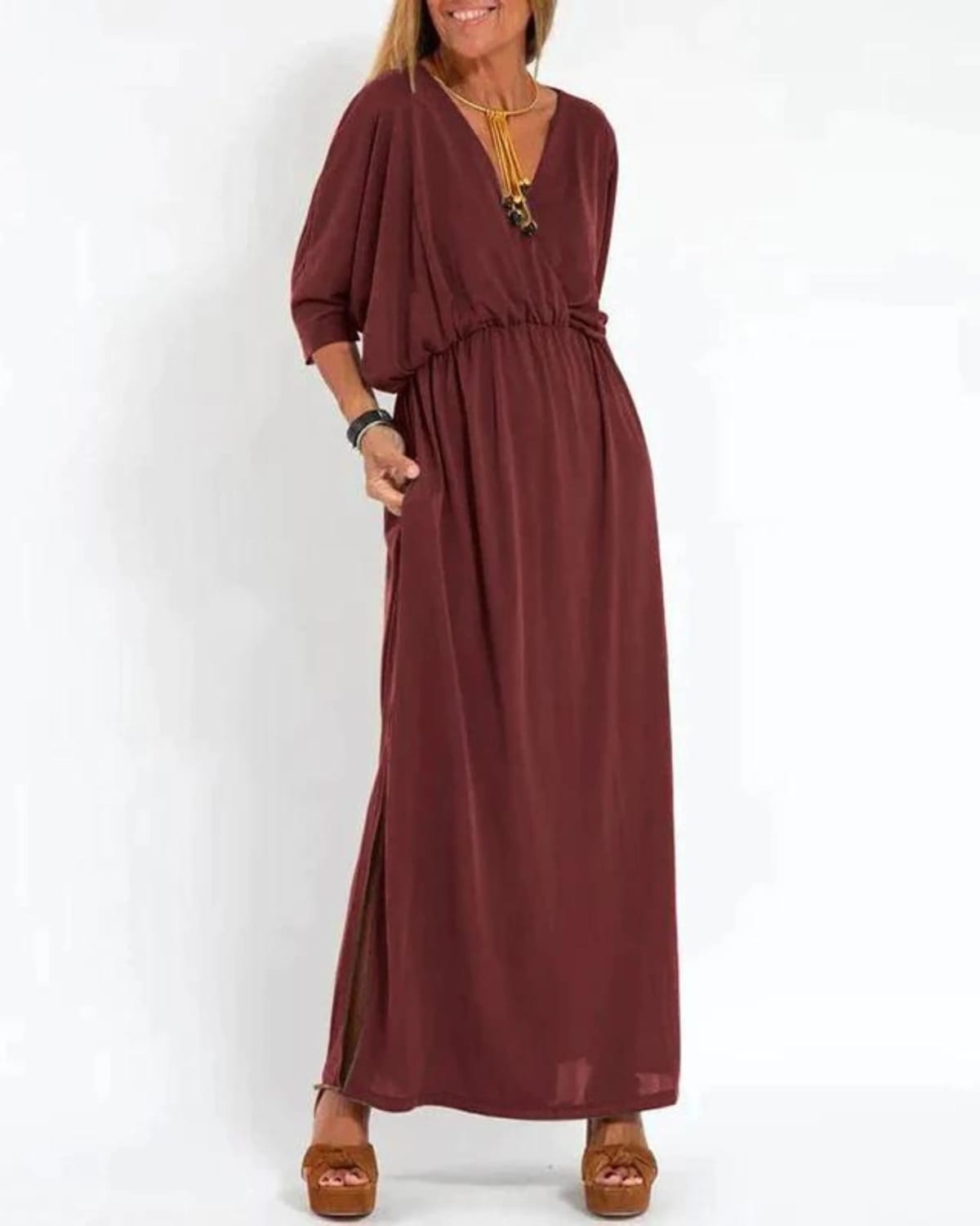 Long flowing dress with tailored fit and lightweight fabric.