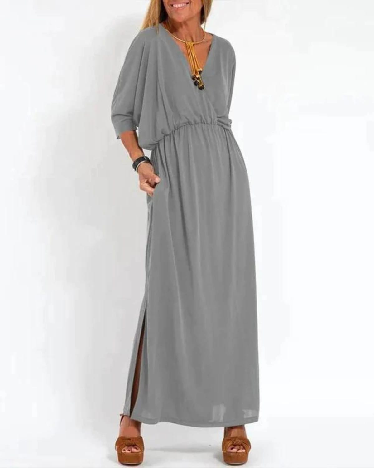 Long flowing dress with tailored fit and lightweight fabric.