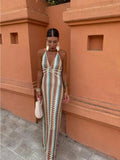 Long-line dress with structured neckline and streamlined fit.