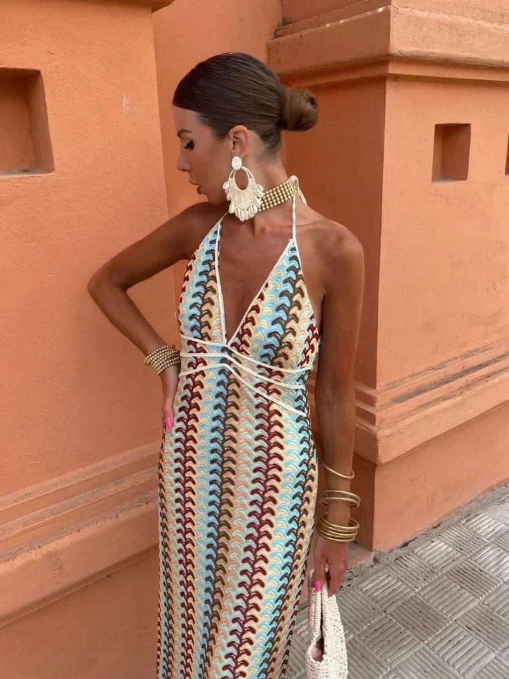 Long-line dress with structured neckline and streamlined fit.