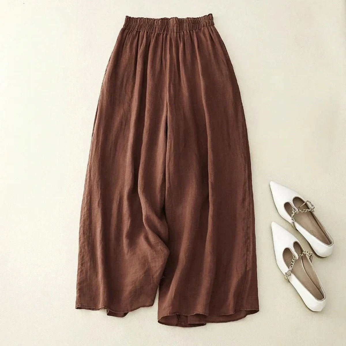 Loose waistband pants with straight leg and breathable fabric.