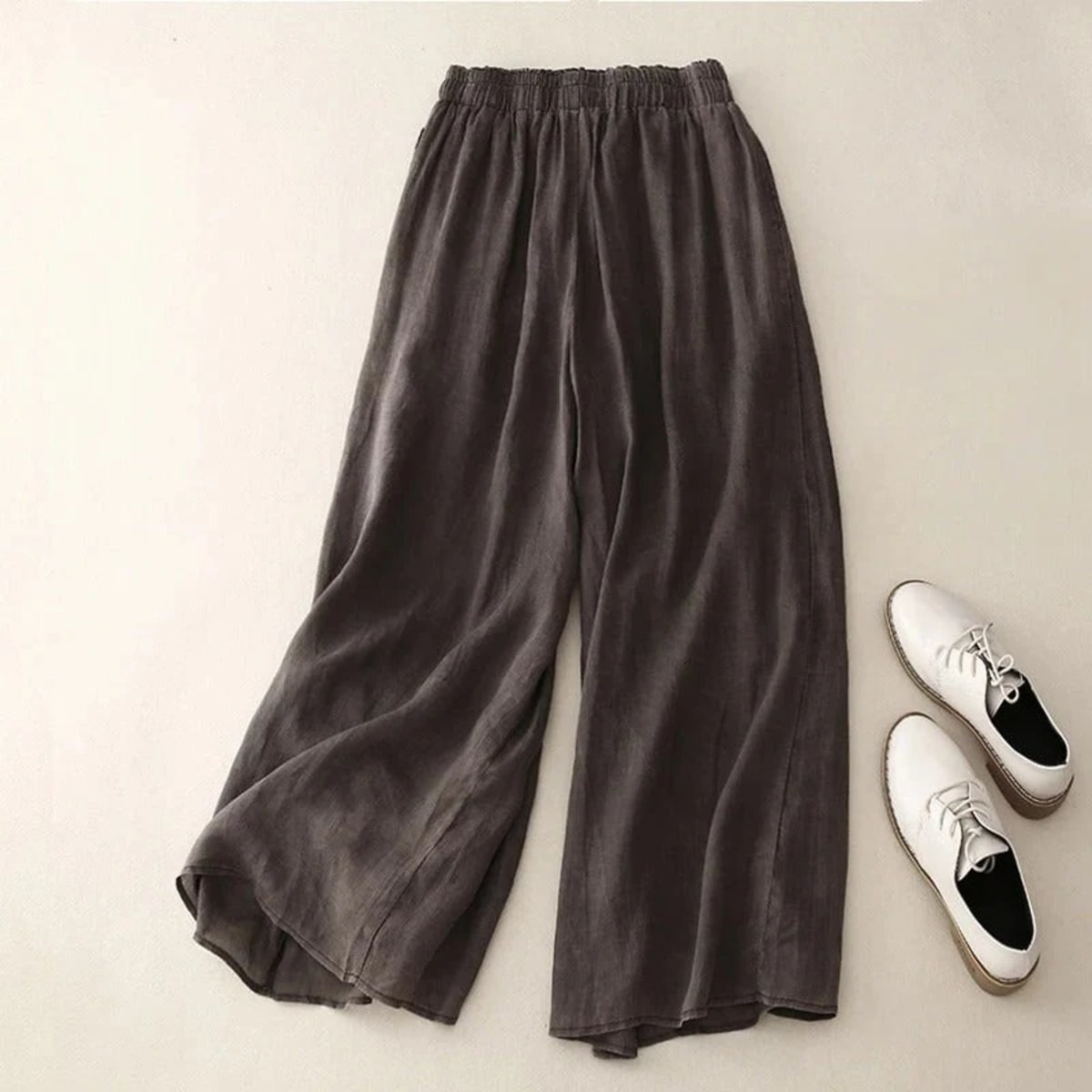 Loose waistband pants with straight leg and breathable fabric.