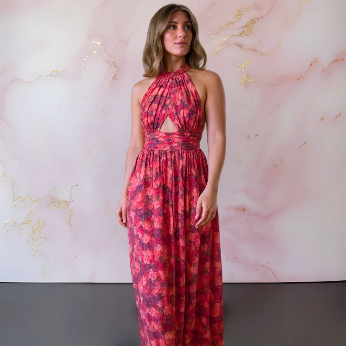 Floral maxi dress with open back and flowing silhouette.