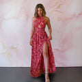 Floral maxi dress with open back and flowing silhouette.