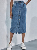 Woman wearing pleated denim midi skirt with buttons.