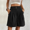 High-waisted wide-leg shorts with pleats and buttons