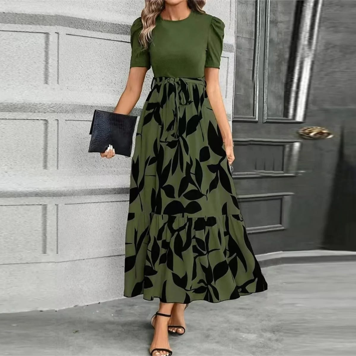 Women's maxi dress with puff sleeves, tie waist, and ruffle hem.