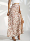 Woman wearing high-waisted floral maxi skirt with slit.