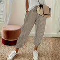 Striped wide-leg pants with mid-rise waist and side pockets.