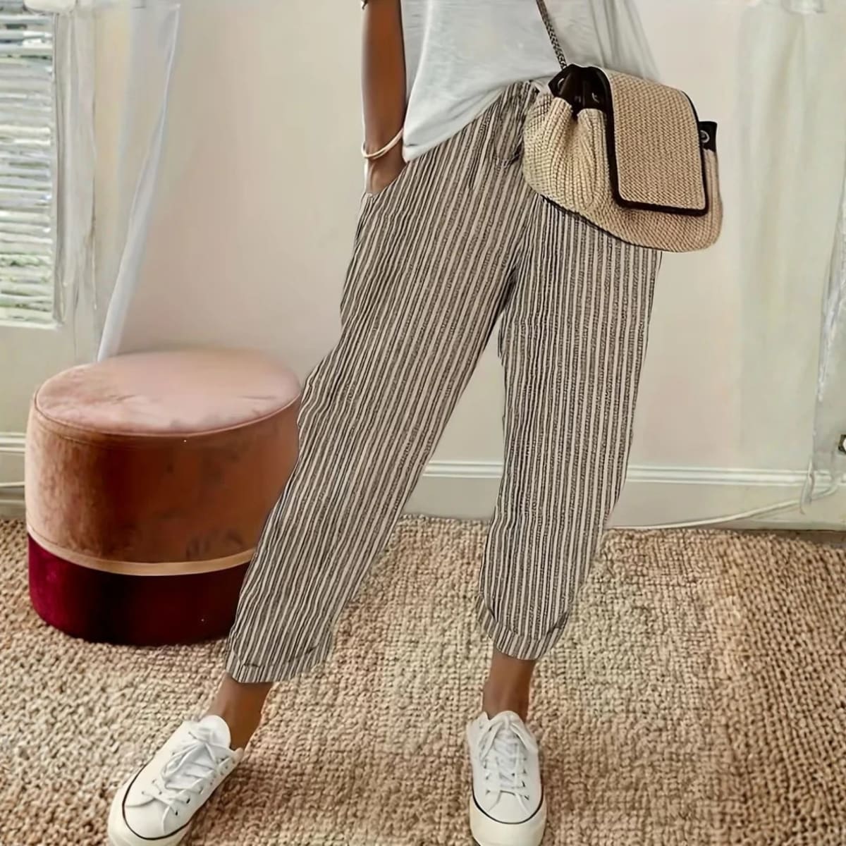 Striped wide-leg pants with mid-rise waist and side pockets.