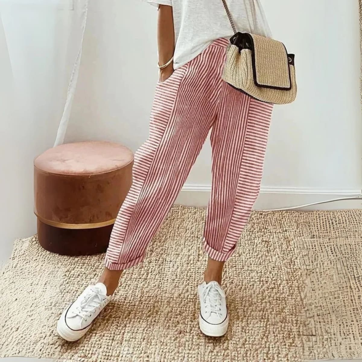 Striped wide-leg pants with mid-rise waist and side pockets.