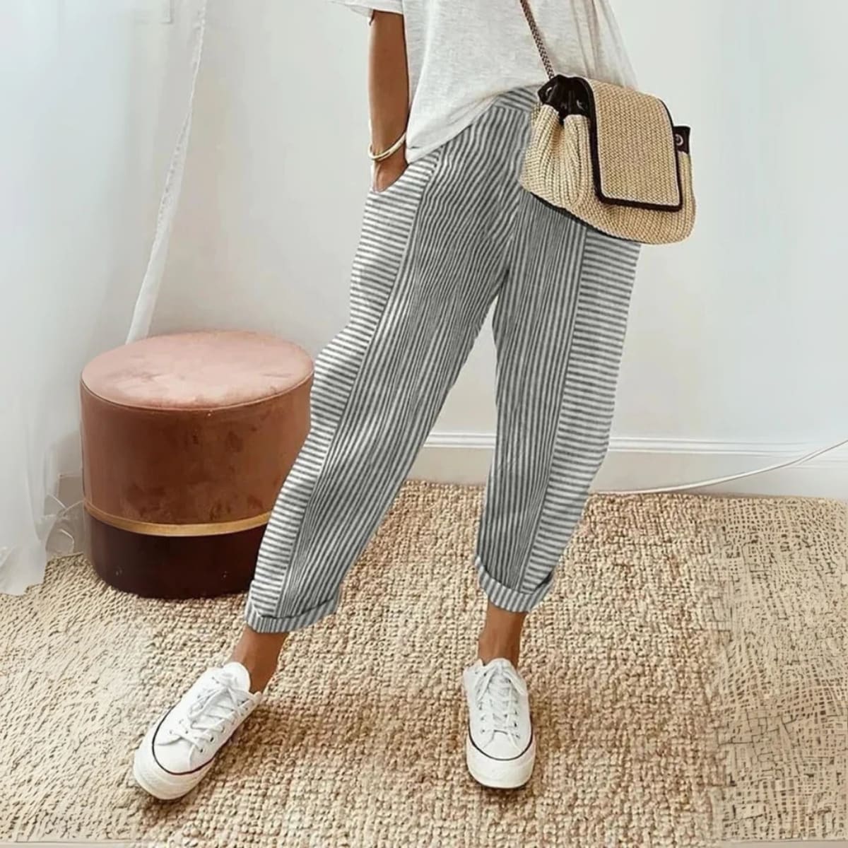 Striped wide-leg pants with mid-rise waist and side pockets.
