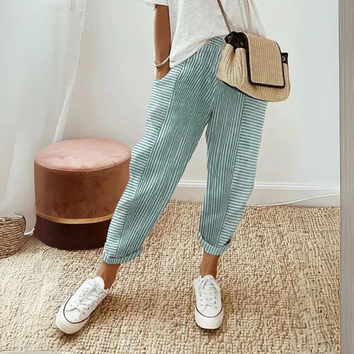 Striped wide-leg pants with mid-rise waist and side pockets.