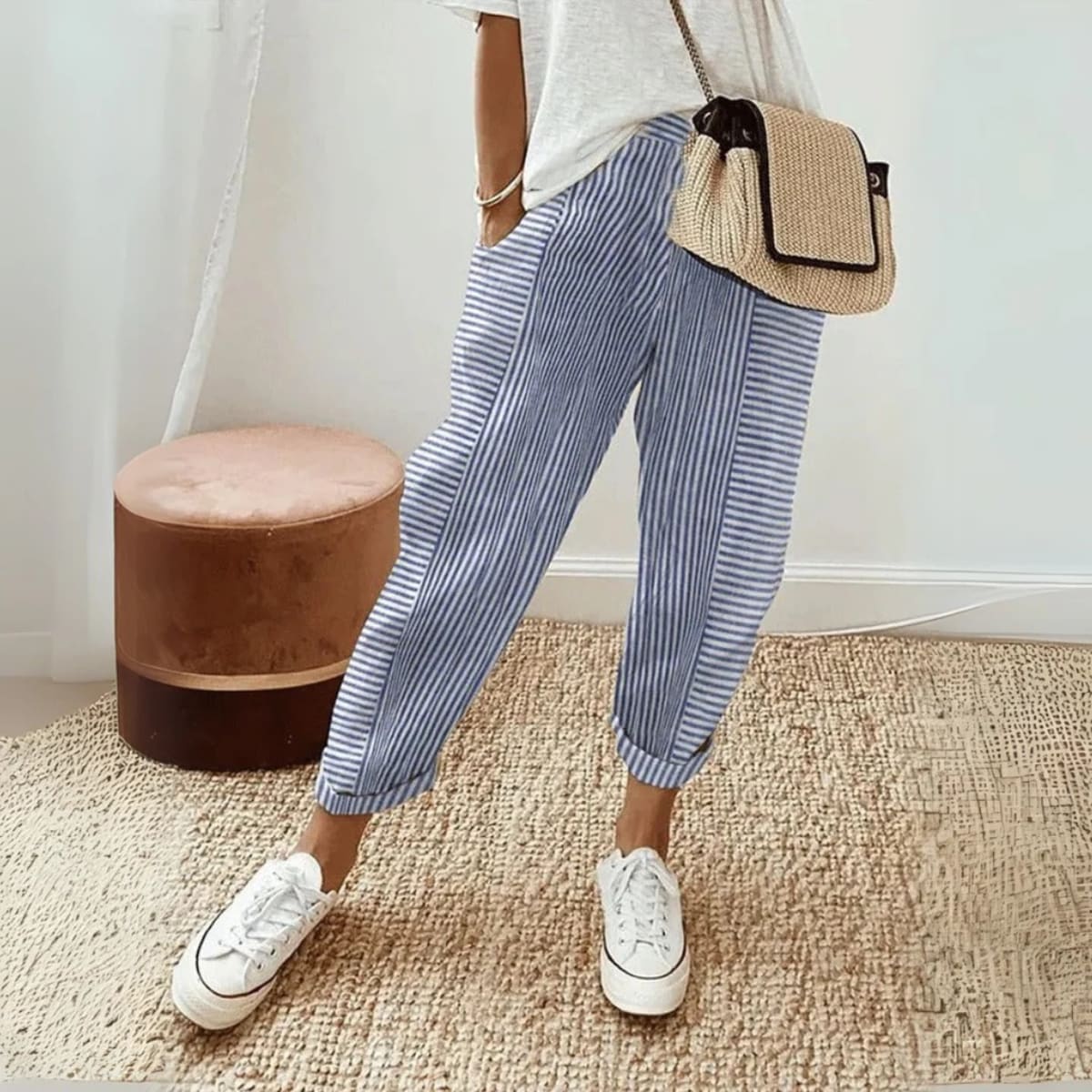 Striped wide-leg pants with mid-rise waist and side pockets.