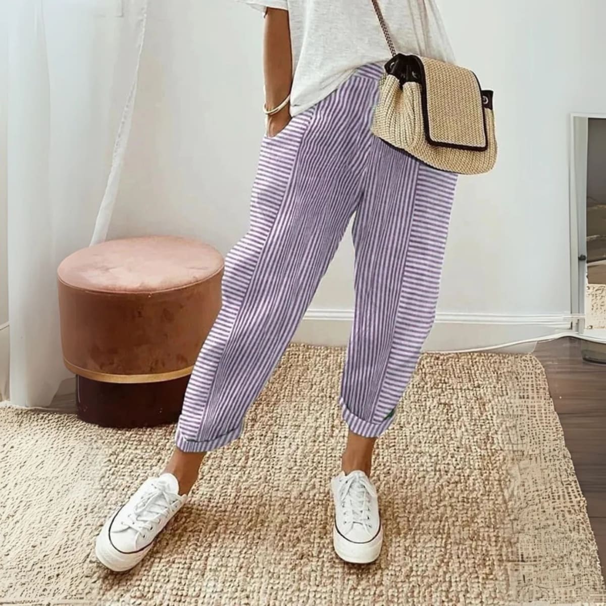 Striped wide-leg pants with mid-rise waist and side pockets.