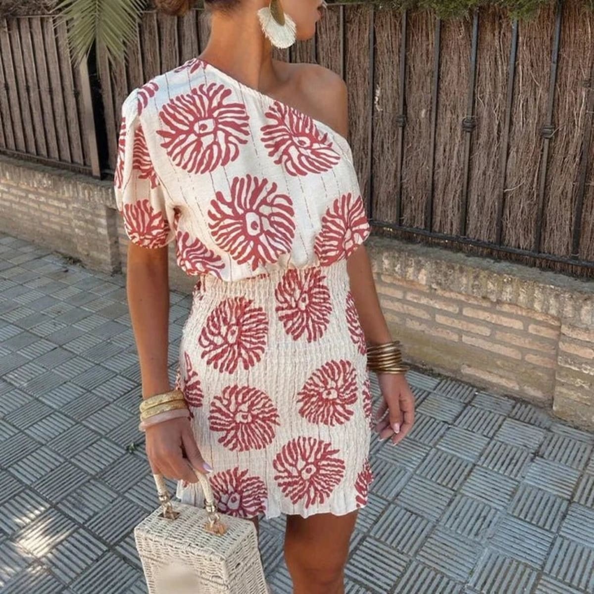 A short dress with relaxed fit and light fabric drape.