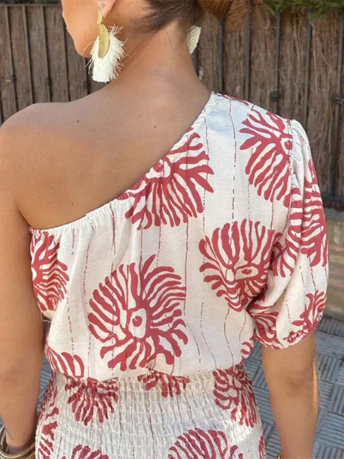 A short dress with relaxed fit and light fabric drape.