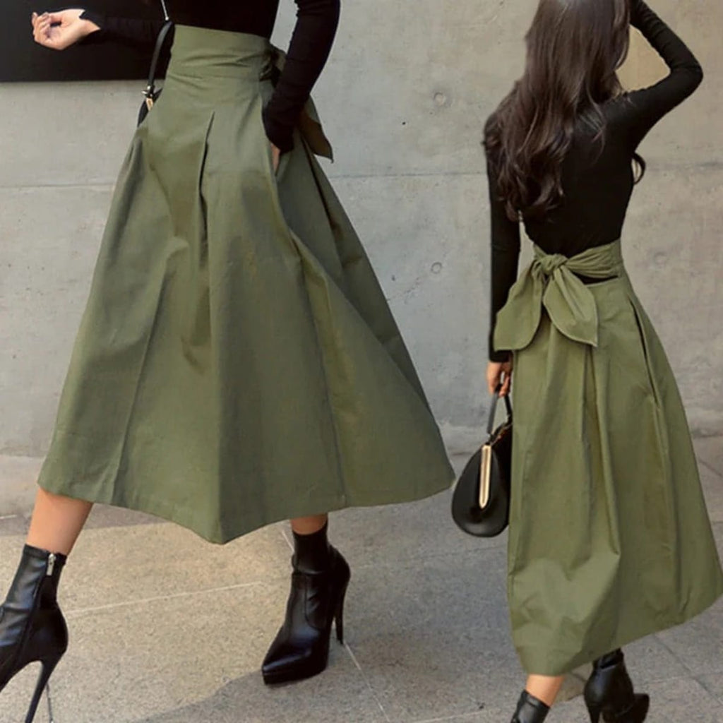 Woman wearing A-line midi wrap skirt with self-tie waist outdoors