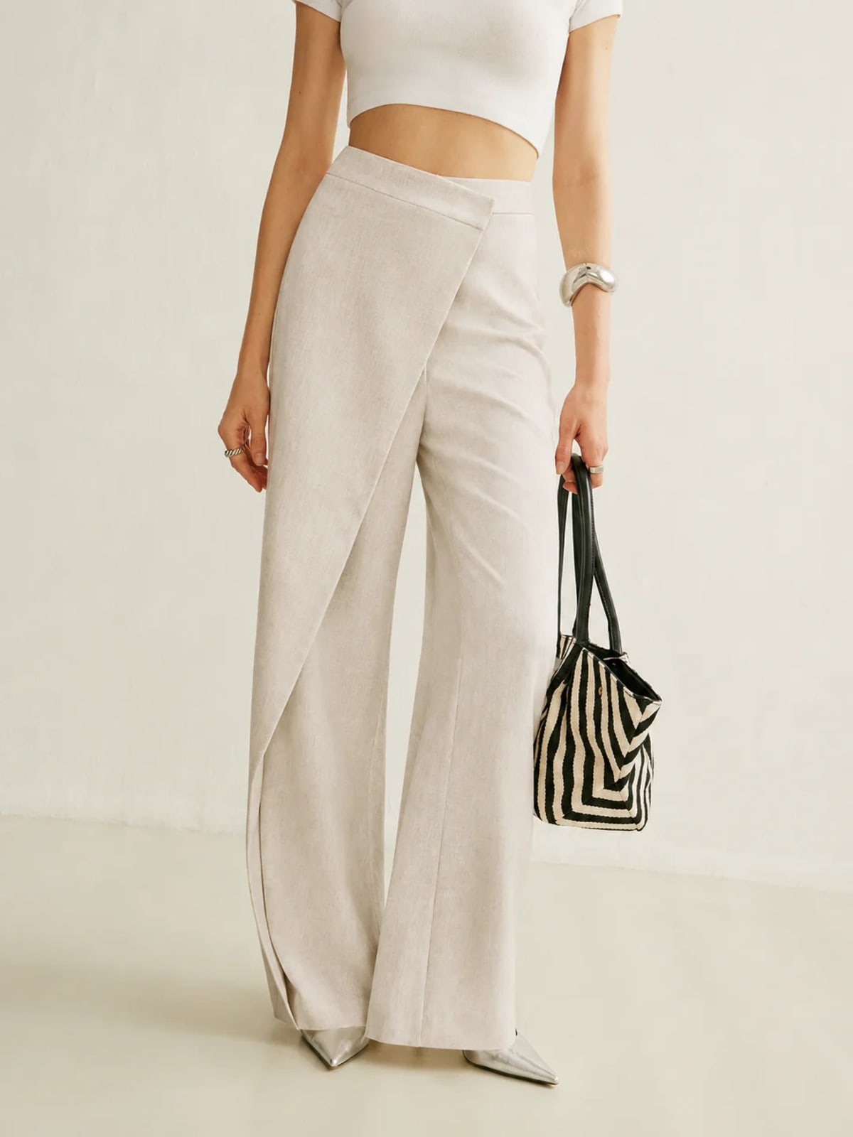 Women's high-waisted wide-leg trousers with wrap front.