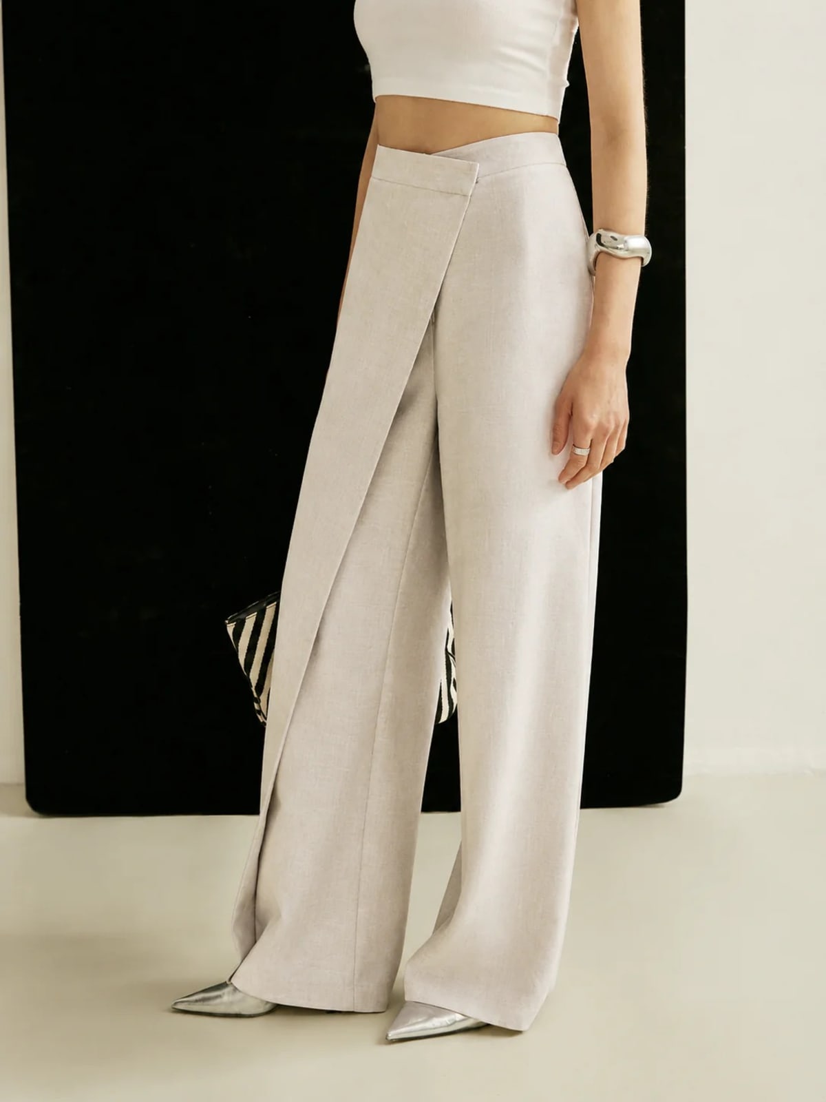 Women's high-waisted wide-leg trousers with wrap front.