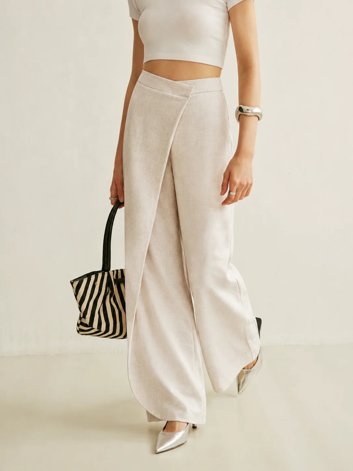 Women's high-waisted wide-leg trousers with wrap front.