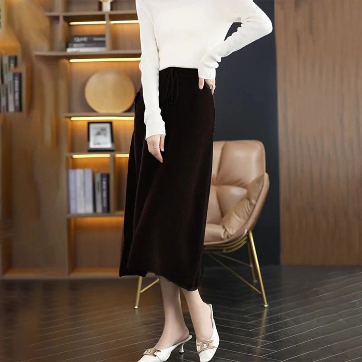Knit midi skirt with drawstring waist and straight silhouette.