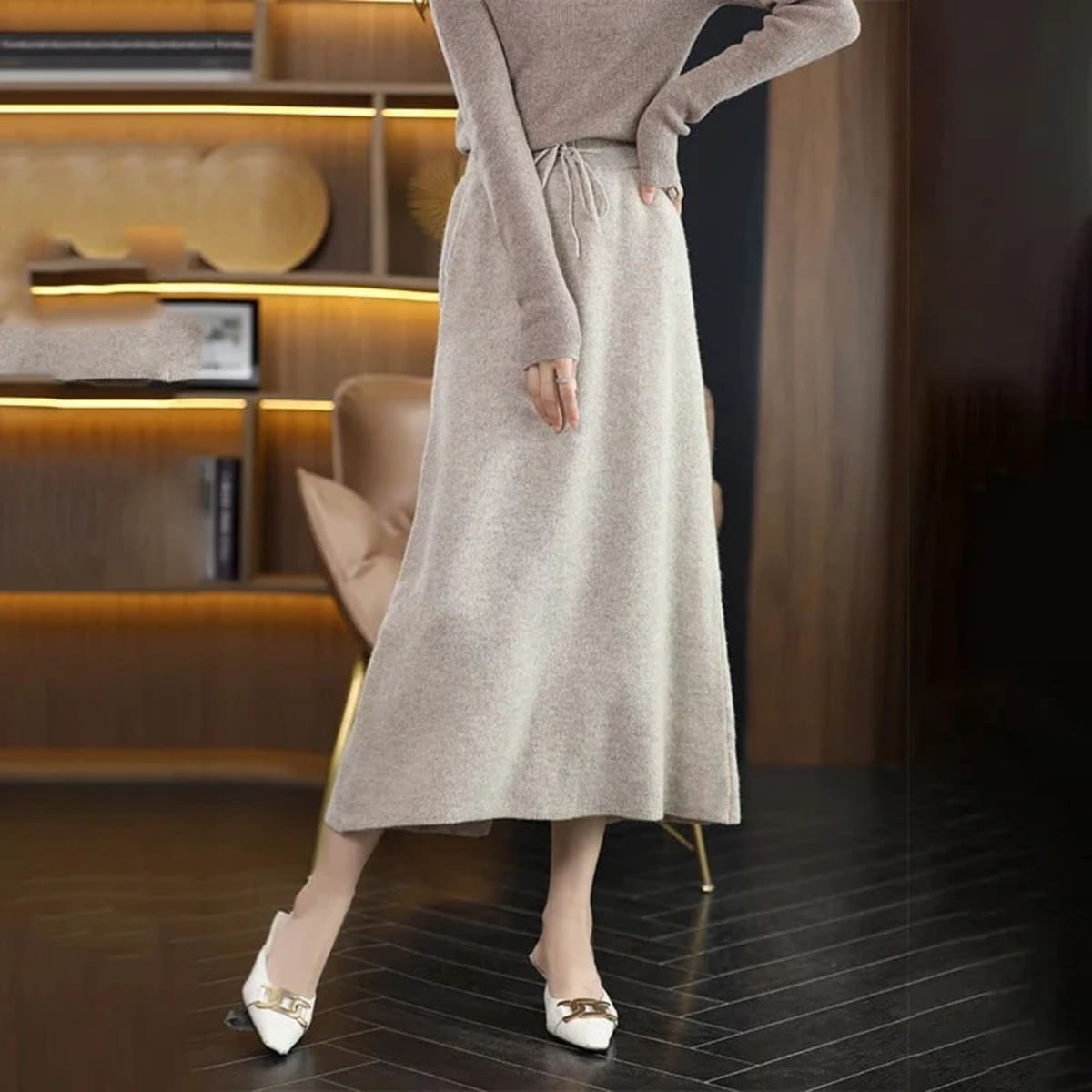 Knit midi skirt with drawstring waist and straight silhouette.